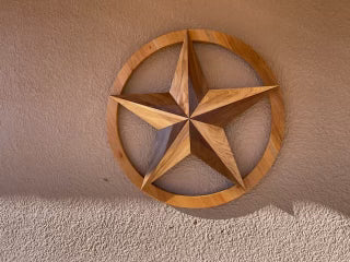 Custom Wooden Texas Star for home decor. Texas Star is made from walnut and white ash with a s Spanish cedar ring. This custom order piece is approximately three feet in diameter with 30 degree bevels. Total Boat Halcyon was used as the top coat varnish for added protection against weather and UV damage. Are you interested in ordering custom wood furniture or woodcraft? Please visit our contact page. 