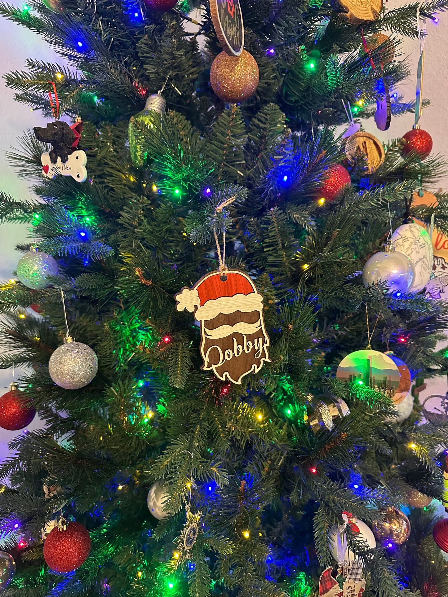 Celebrate your loved ones and cherished friends with this personalized Santa ornament. This adorable ornament is available for personalization with no extra cost.  After you check out, visit our Custom Order Page to fill out what personalized name you would like to request on this page. If you do not hear from you within 72 hours, We will contact you to receive your personalization request. 