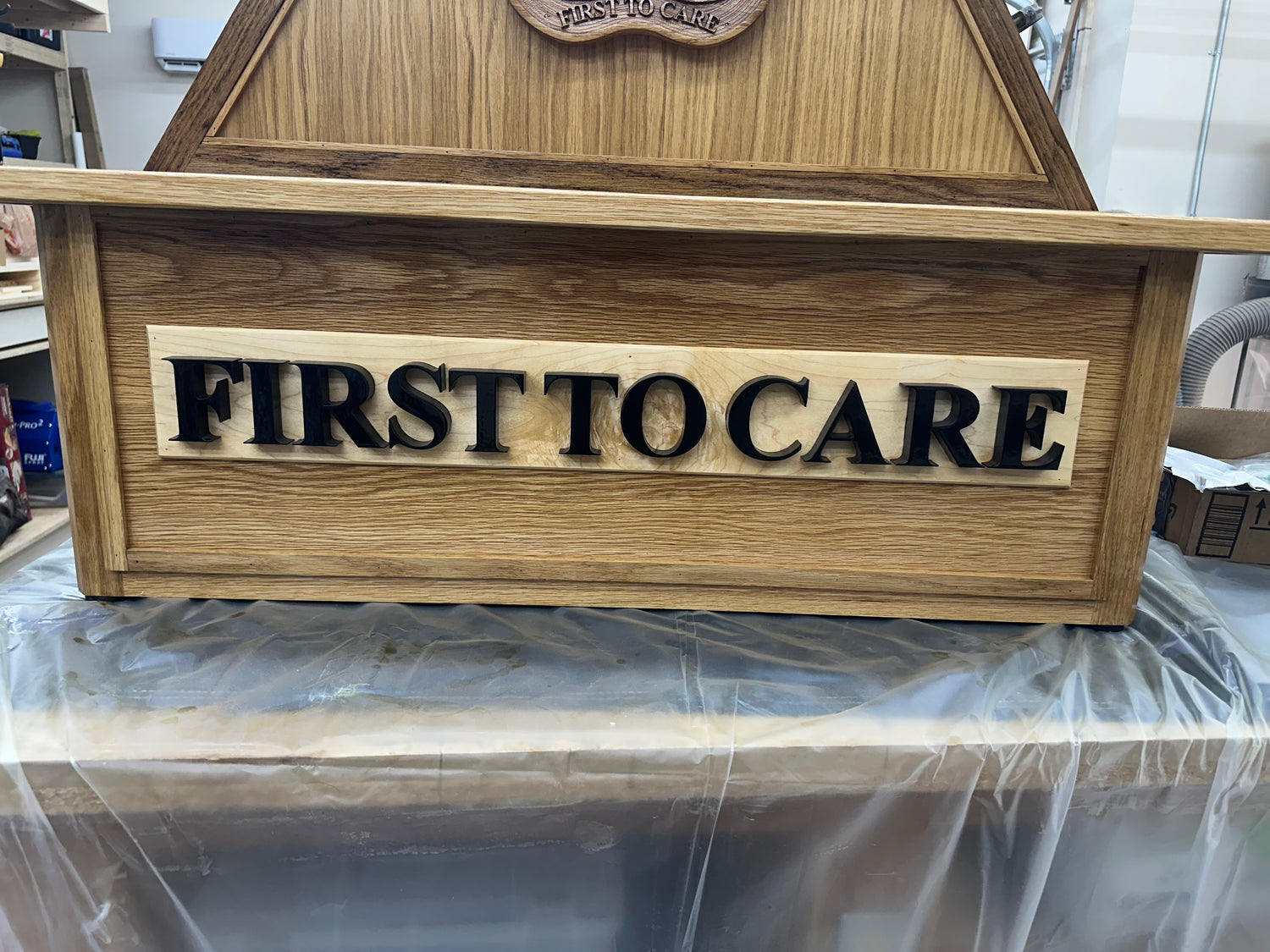 Custom 3D lettering of WBAMC's motto, "First To Care." This is on a solid piece of hard maple and painted with Total Boat's one-part polyurethane. 